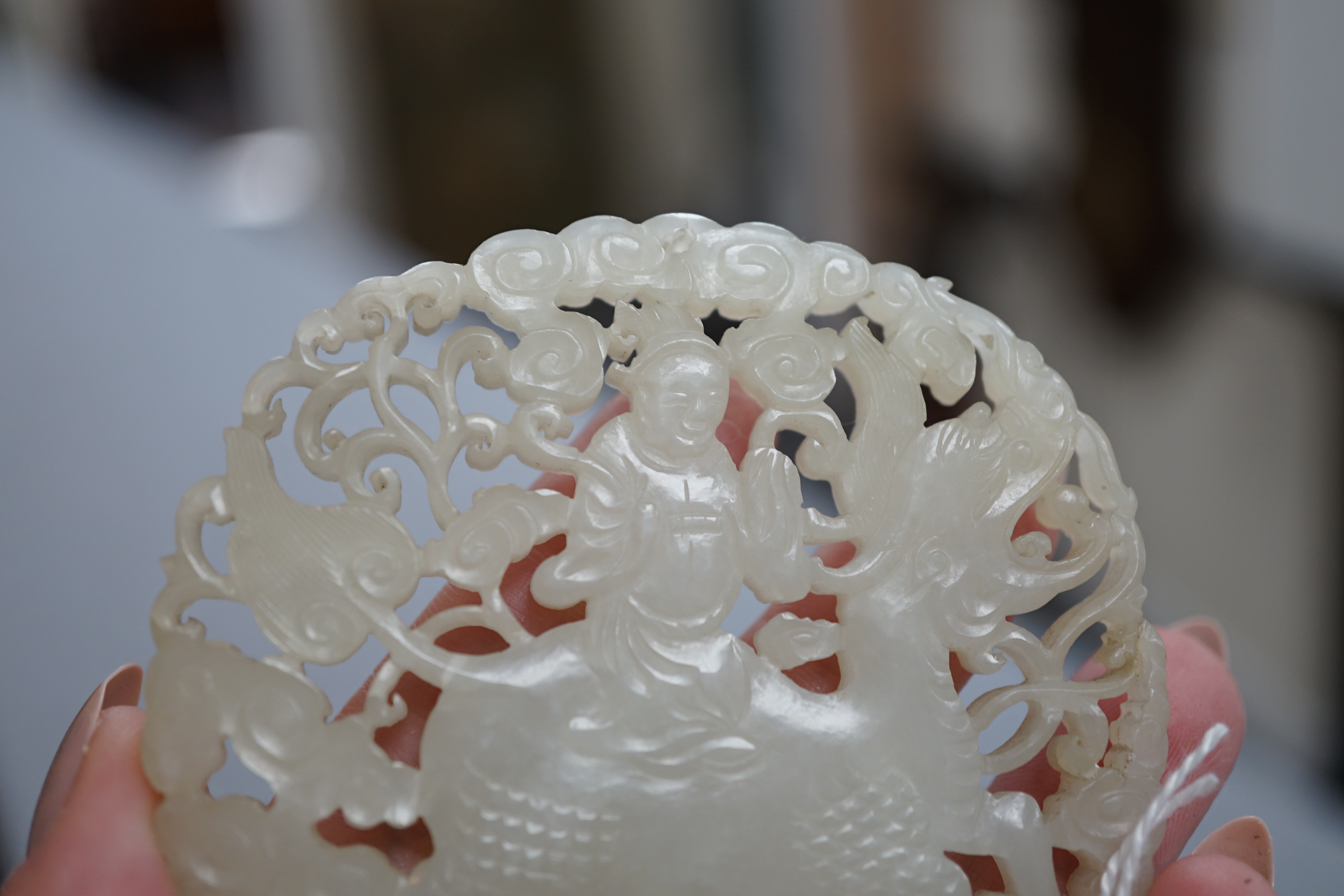 A Chinese white jade ‘qilin and rider’ plaque, 18th/19th century